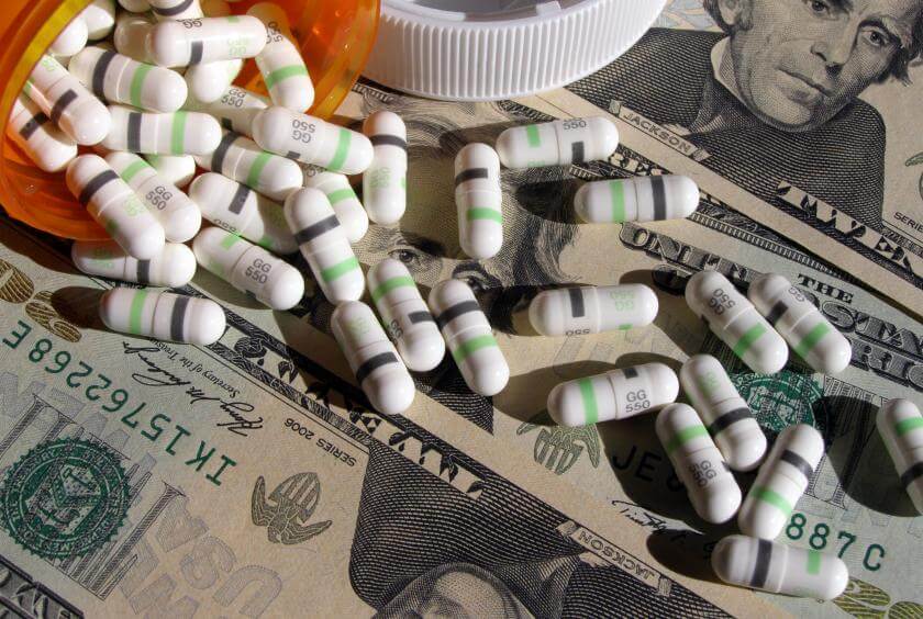 prescription-pills-sprawled-over-money